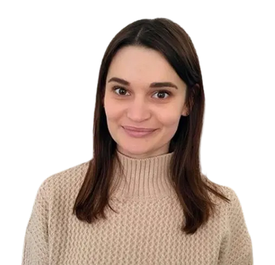 Woman wearing a beige sweater against a white background